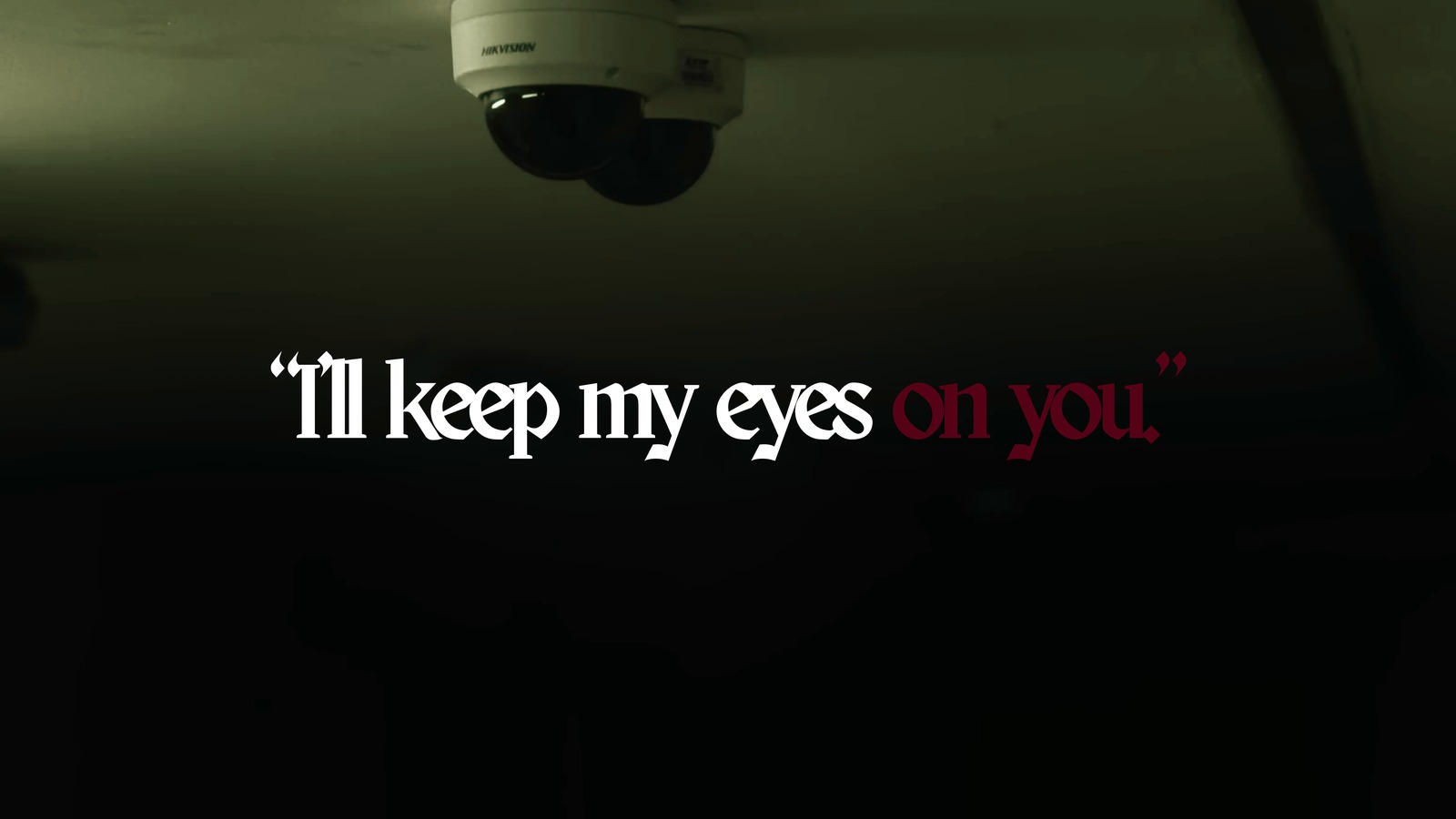 Quote slide, I'll keep my eyes on you, over a ceiling mounted security camera